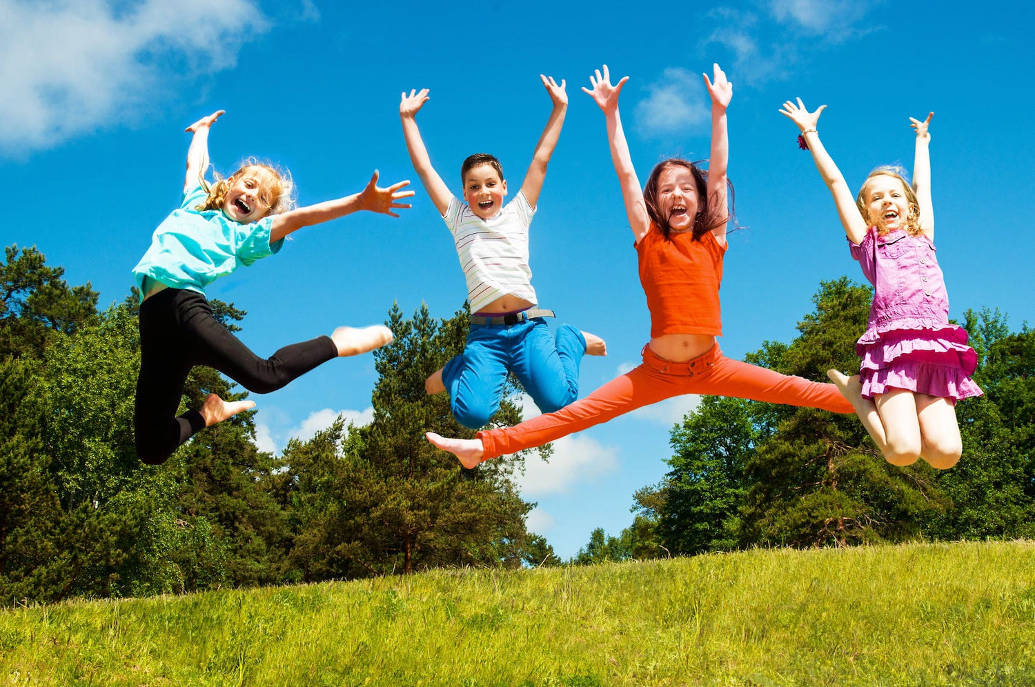 Kids exercising outside in the grass